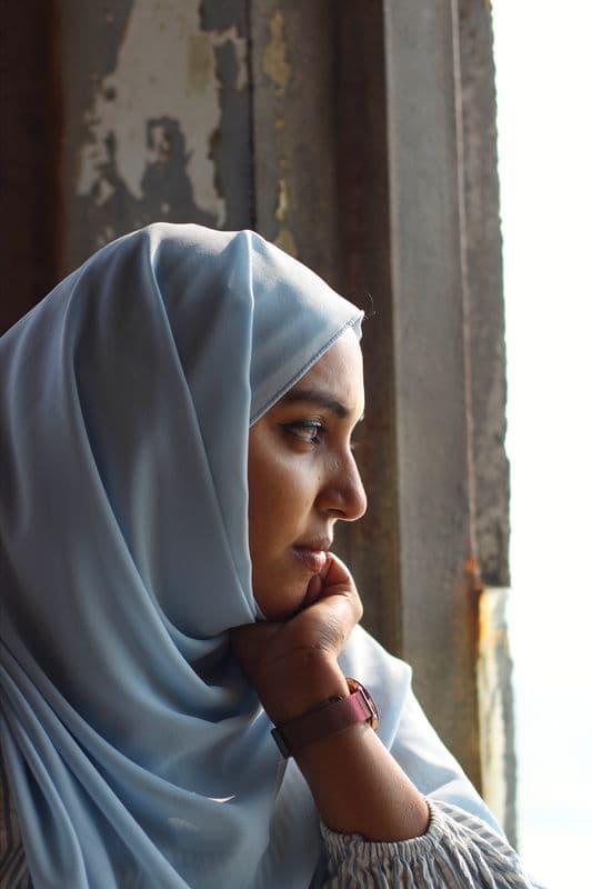 A pilgrim looking out of a window
